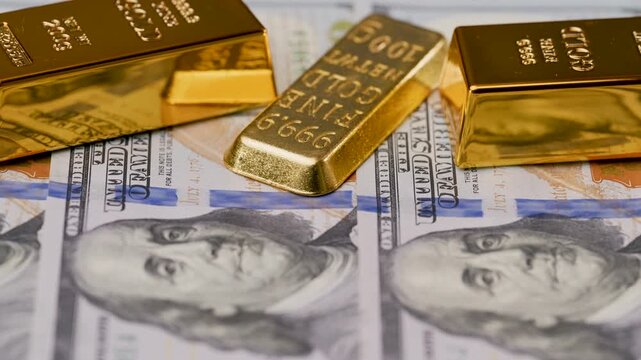 video of a gold bar with dollar bills