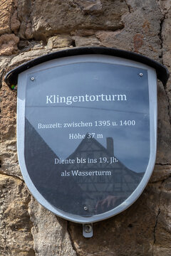 Rothenburg ob der Tauber, Germany - May 24, 2025: Memorial plaque describing Klingentorturm, built between 1395 and 1400, a 37-meter tower that served as a water tower until the 19th century.