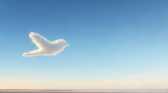 Minimalist Photo of a Single Bird Shaped Cloud in a Wide Clear Blue Sky Over a Calm Ocean Horizon