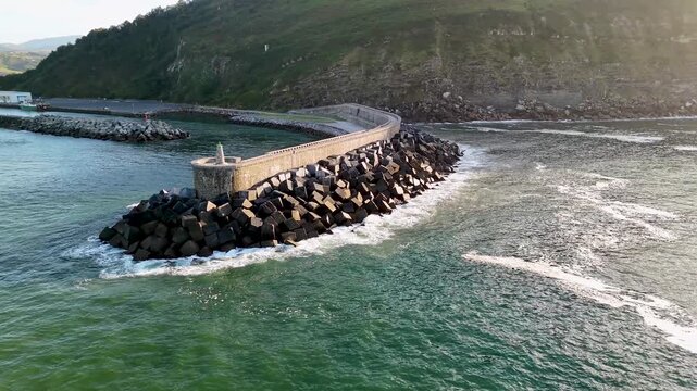 Aerial view of the stone breakwater at Antilla beach in Orio, Spain