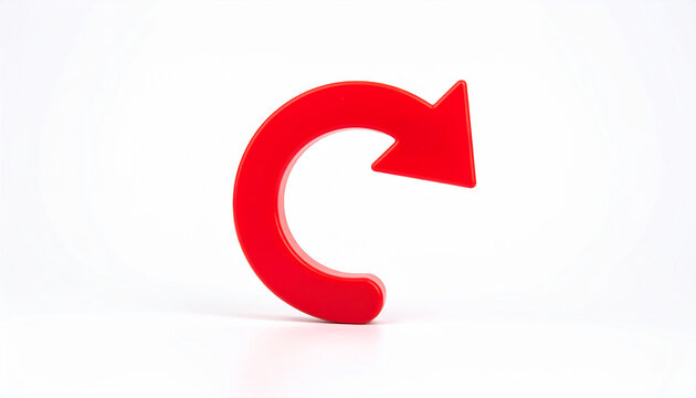 Red curved arrow on white background, minimalist composition. Redirection, navigation and return concept. Close-up.