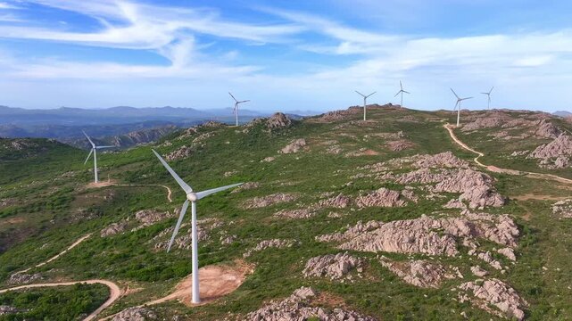 Aerial view of wind turbines on mountain landscape in Sardinia, Italy