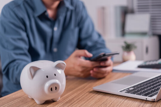 Piggy Bank and Smartphone for Personal Savings Planning