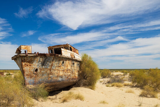 An abandoned, rusting boat in the Moynaq Ship Graveyard, Uzbekistan. Now the Aralkum Desert, this area was formerly part of the Aral Sea