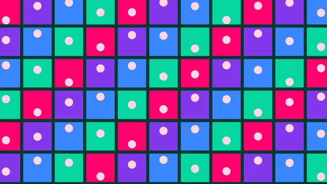Colorful square tiles with white dots arranged in a repeating grid pattern.