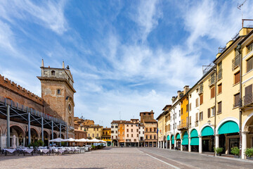 mantua,town square,old town, panoramic view of Piazza delle Erbe in Mantua  , Lombardy, Italy, featuring the medieval Clock Tower  on the left © travelview
