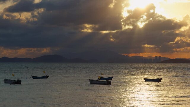 Sunset Golden Sea Boats Tyndall Light Rays Dramatic Sky Handheld