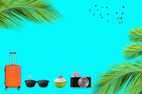 Orange Suitcase And Travel Accessories Flat Lay On Blue Background