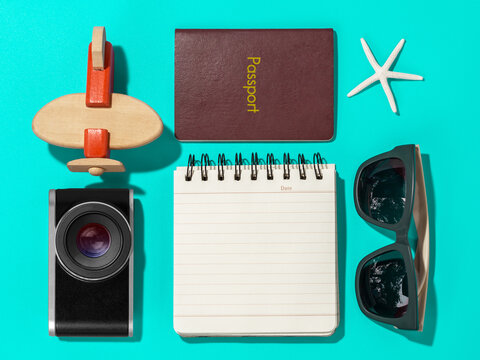 travel blogger writing equipment on blue background