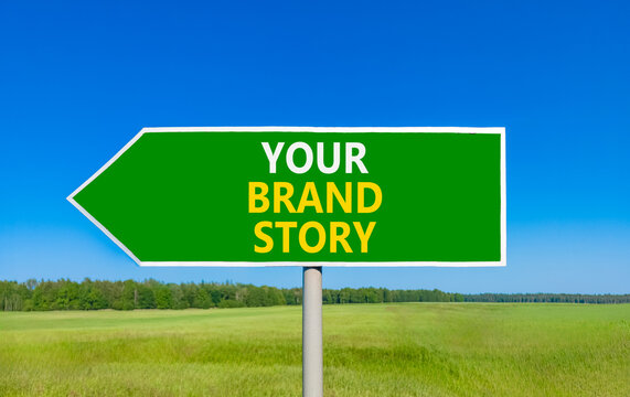 Branding and your brand story symbol. Concept words Your brand story on beautiful green road sign. Beautiful blue sky green grass background. Business branding your brand story concept. Copy space.