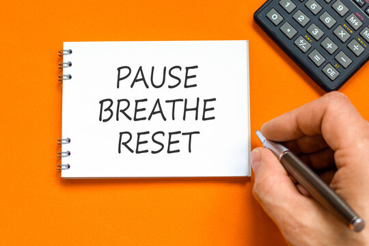 Pause breathe reset words symbol. Concept words Pause breathe reset on beautiful white note. Beautiful orange background. Business support motivational and pause breathe reset concept. Copy space.