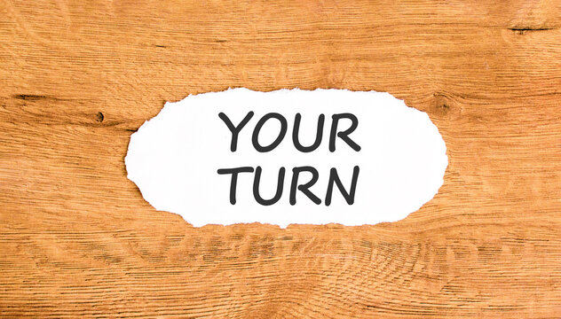 Your turn words symbol. Concept words Your turn on beautiful white paper. Beautiful wooden background. Business your turn motivational support concept. Copy space.