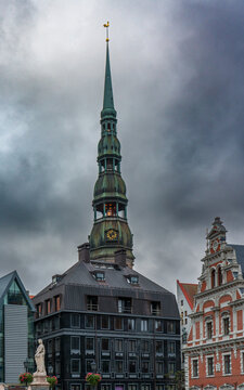 The distinctive green copper spire and clock tower of St. Peter's Church in Riga Latvia