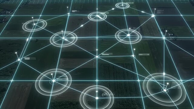 Digital Network Overlay on Agricultural Landscape - This overhead view shows a digital network grid with glowing blue lines connecting various points over a landscape of agricultural fields.
