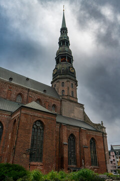 The distinctive green copper spire and clock tower of St. Peter's Church in Riga Latvia
