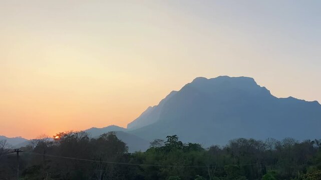 A time-lapse (TL) of moving sunset. Doi Luang Chiang Dao is a beautiful place with greenery around. It is the third highest mountain in Thailand.