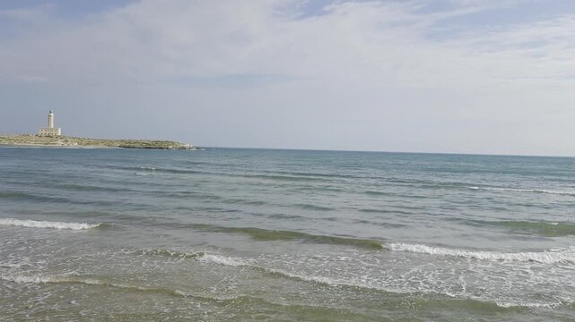 The lighthouse at the entrance to the bay of Vieste, a town on the Adriatic Sea, Italy..