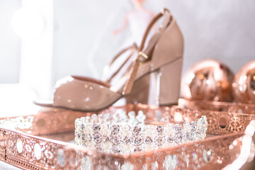 Elegant crystal bridal tiara on luxury rose gold mirror tray © Marcelle Mineiro