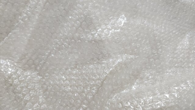 transparent plastic bubble wrap texture, air-cushion packaging material, surface, close-up, texture, background, shock-absorbing material, cushioning material, simple