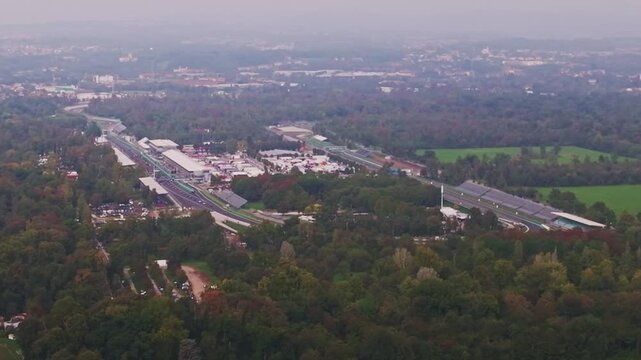 Aerial drone view of Autodromo Nazionale Monza in Monza, Italy, showcasing the iconic Formula 1 racing circuit, racetrack, grandstands, and surrounding parkland.