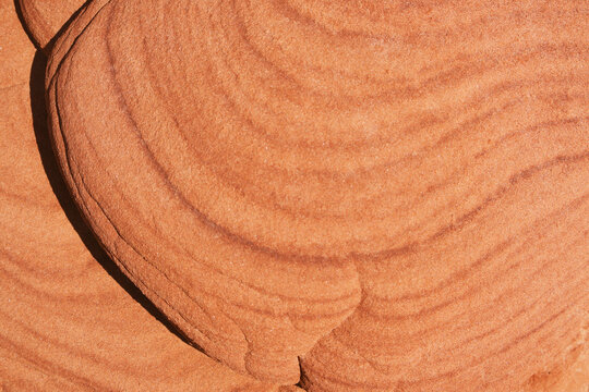 Artistic abstract wave pattern on red sandstone rock surface, Sok Phi Dip geosite in Khon Kaen-Korat province of Thailand