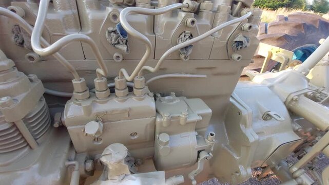 restored painted tractor engine block with fuel injection pump