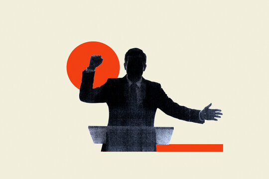 Silhouette of politician standing at podium raising fist during political campaign speech