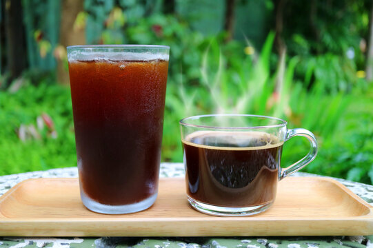 Iced Coffee and Hot Coffee with Steam Served on Garden Table