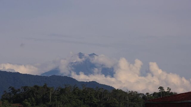 Wide Time-Lapse Shot of Sangay Volcano Being Covered by Clouds During Early Morning in Macas, Ecuador
