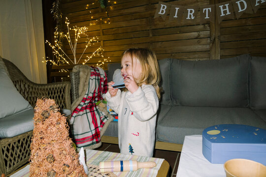 Child With Toy Harmonica