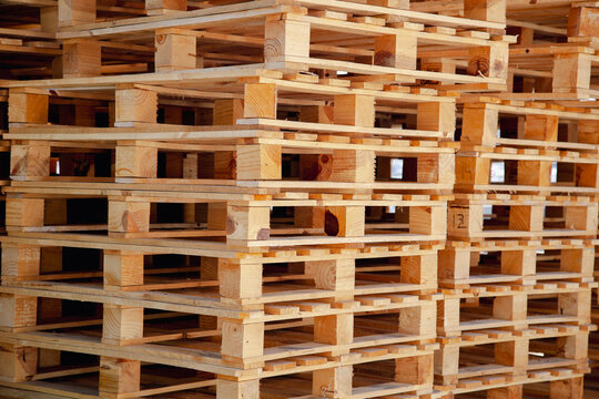 Stacked wooden pallets in industrial storage