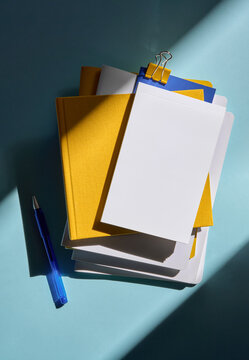 Office Still Life With Various Blank Notebooks And Stationery Supplies