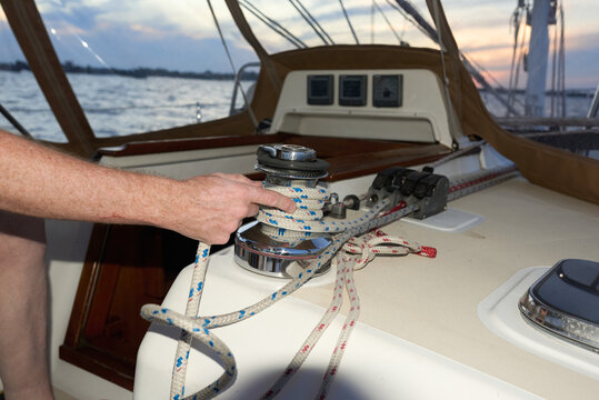 Man wrapping a sailing line