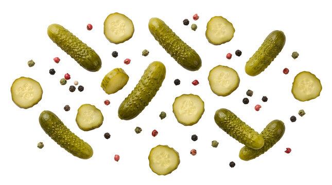 Fresh crisp pickled cucumbers with mixed peppercorns arranged neatly on transparent background