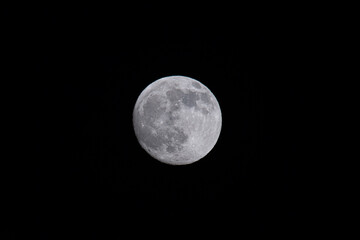 Detailed view of the bright full moon against a dark night sky, captured in Keelung, Taiwan. © twabian
