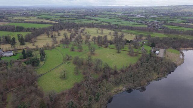 High aerial view over the Shane's Castle estate parkland, woodland and the shore of Lough Neagh, County Antrim, Northern Ireland