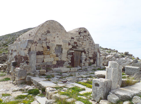 Historic stone ruins of Castle of St Nicholas, a historic Byzantine castle structures near the sunset viewpoint in Oia, Santorini, Greece