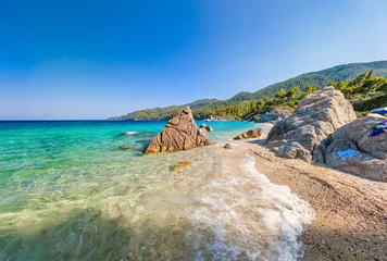 Pointed rock and swimmers in clear water, Sithonia © Martin Valigursky
