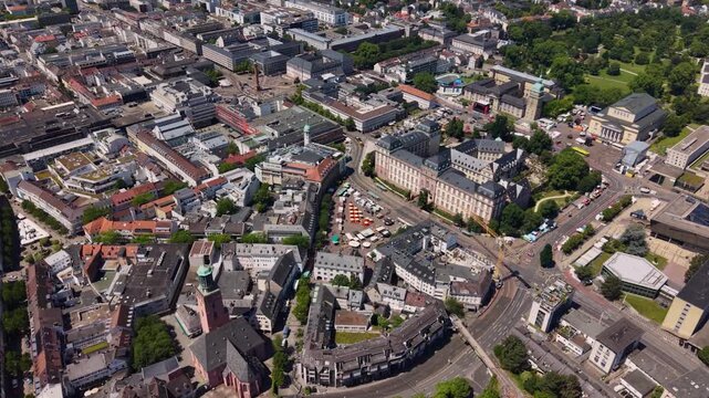 A wide aerial view above the downtown beside the city Darmstadt in Germany, Hesse on a sunny summer day
