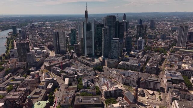 A wide aerial view above the downtown beside the city Frankfurt in Germany, Hesse on a sunny summer day
