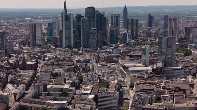 A wide aerial view above the downtown beside the city Frankfurt in Germany, Hesse on a sunny summer day