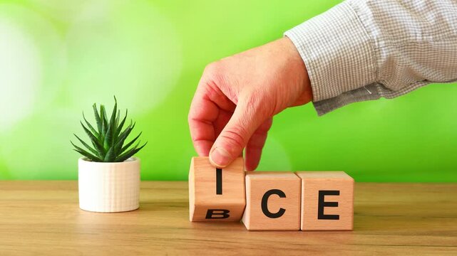 Businessman changes the symbol ICE on BEV. Concept of transitioning from an internal combustion engine vehicle to an electric vehicle. Internal Combustion Engine vs Battery Electric Vehicle
