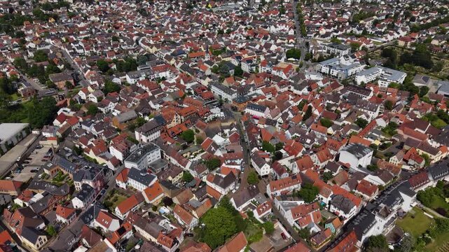 A wide aerial view above the old town beside the city Hochheim am Main in Germany, Hesse on a sunny summer day