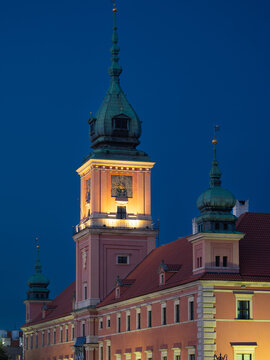 2025-10-23; Royal Castle clock tower illuminated at night in Warsaw. Poland