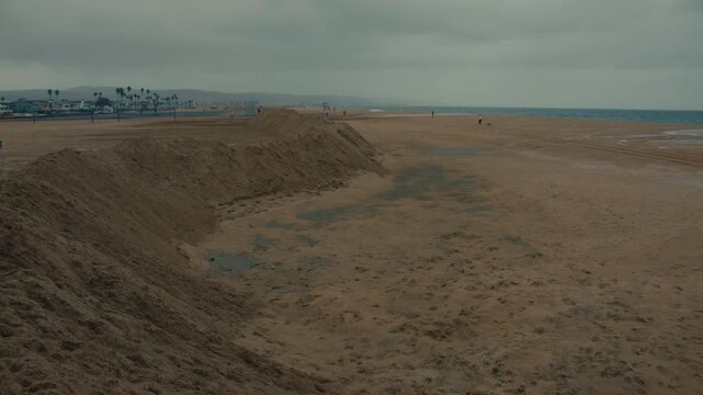 Protective flood berms made from compacted beach sand help defend Newport Beach from ocean surges.
