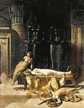 Three woman in an opulent antique room, one lying unconscious and one sitting on a sofa, surrounded by Egyptian statues. The death of Cleopatra, Painting by John Maler Collier (28 January 1850, 11 April 1934), British writer and painter, Historical, digitally restored reproduction from a 19th century original, Record date not stated