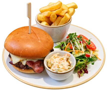 Bacon cheeseburger meal with french fries and salad