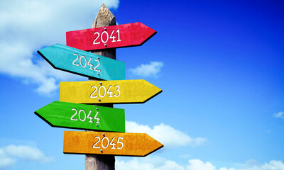 2041, 2042, 2043, 2044, 2045 - wooden signpost with five arrows, sky with clouds © PX Media