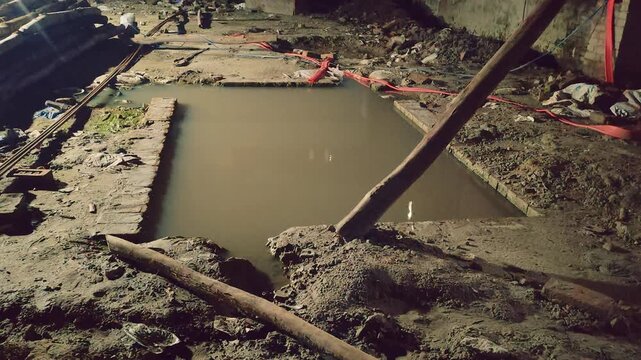 Construction Site at Night with Excavated Ground and Earthmoving Work in Progress