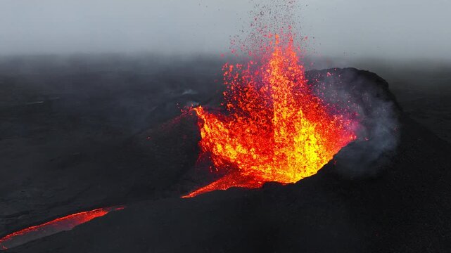 Active Volcanic Crater Erupting Molten Lava Fountain with Smoke and Ash Cloud Field